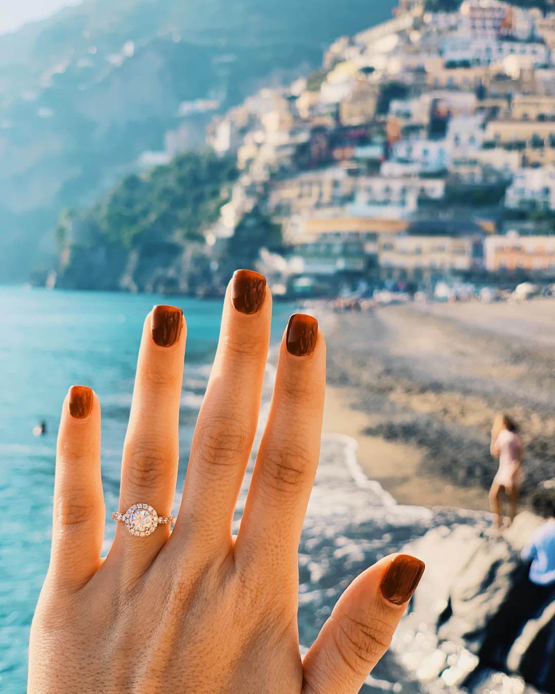 1 carat diamond on hand in a halo setting